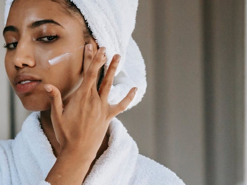 Sunscreen Guide — woman applying skincare